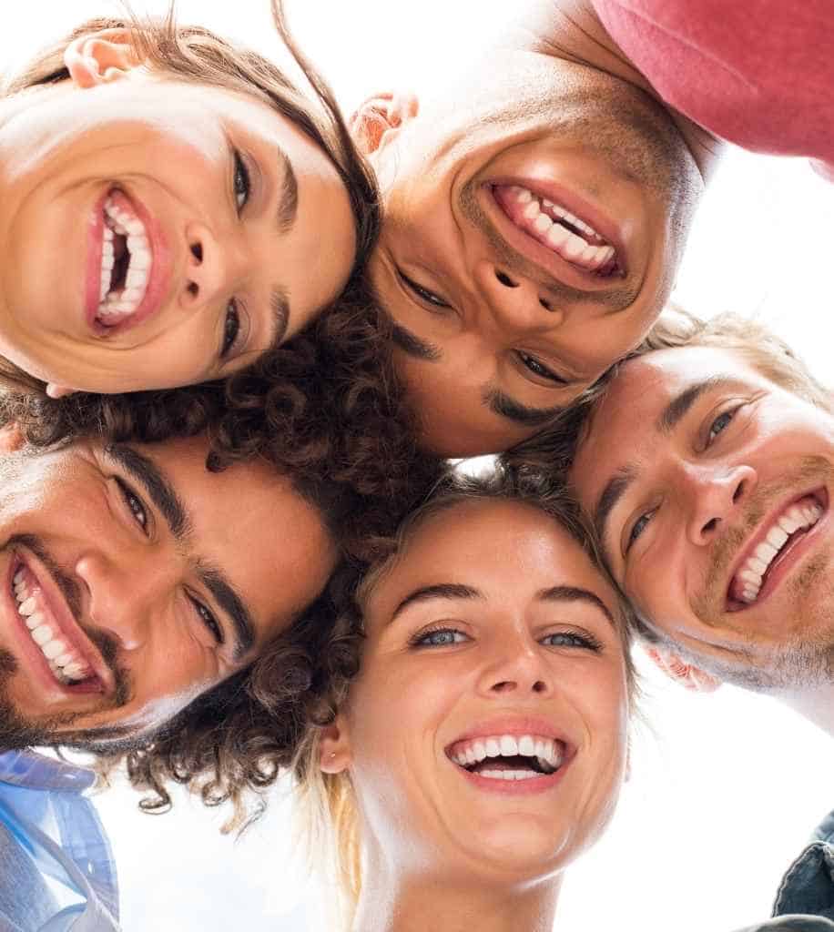 Smiling person showcasing white teeth after laser whitening treatment Brighton